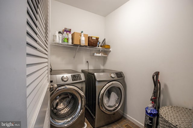 clothes washing area featuring washing machine and dryer