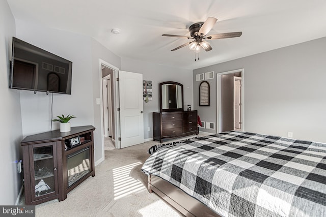 bedroom with light carpet and ceiling fan