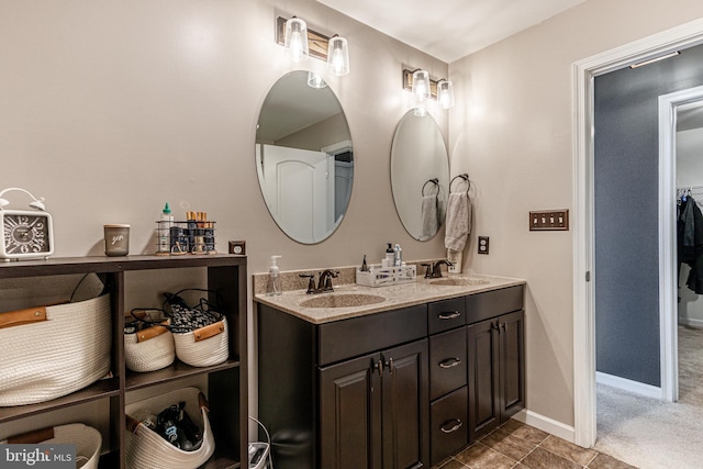 bathroom with tile patterned flooring and vanity