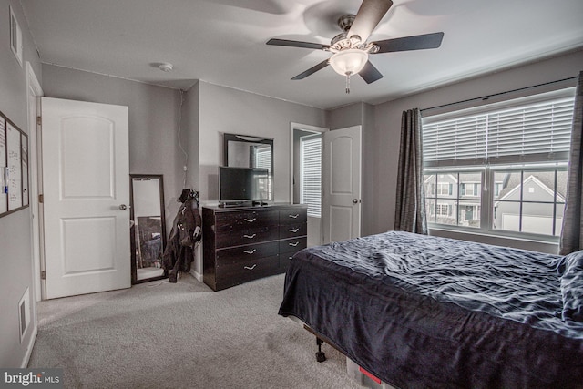 bedroom with light colored carpet and ceiling fan