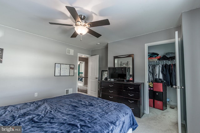 bedroom with light carpet, a closet, and ceiling fan