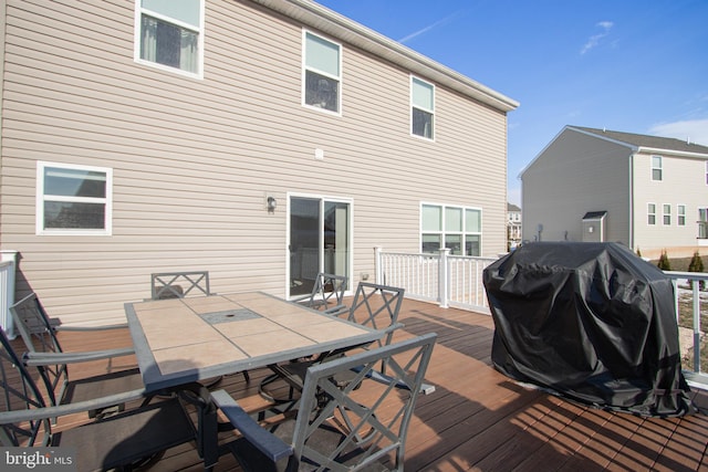 back of house featuring a deck