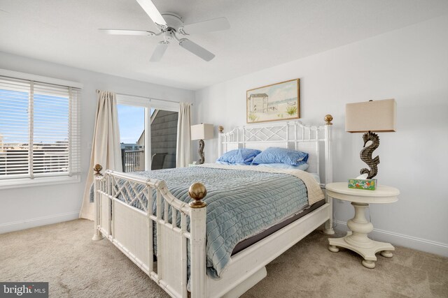 carpeted bedroom with access to outside and ceiling fan