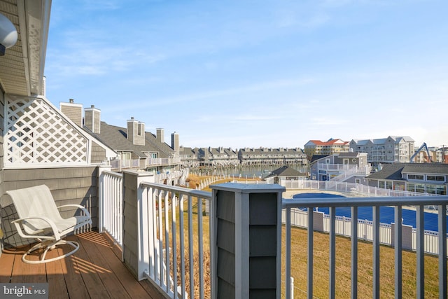 balcony featuring a water view