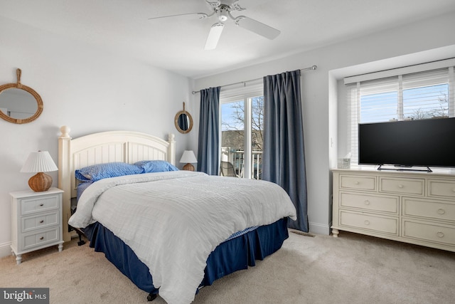 bedroom featuring light carpet and ceiling fan