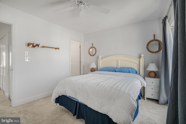 bedroom featuring light colored carpet and ceiling fan