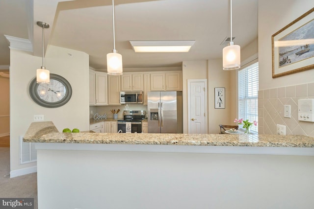 kitchen featuring light stone countertops, visible vents, a peninsula, stainless steel appliances, and backsplash