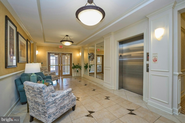 hall featuring ornamental molding, elevator, french doors, light tile patterned flooring, and a raised ceiling