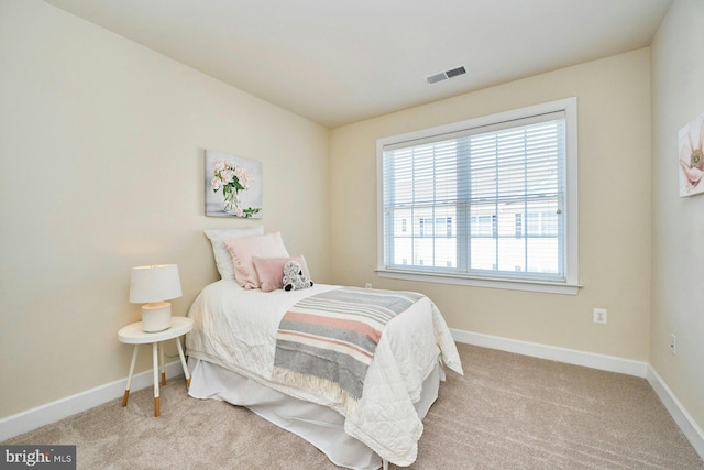 bedroom featuring visible vents, baseboards, and carpet floors