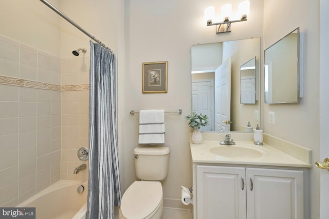 bathroom featuring vanity, toilet, and shower / tub combo