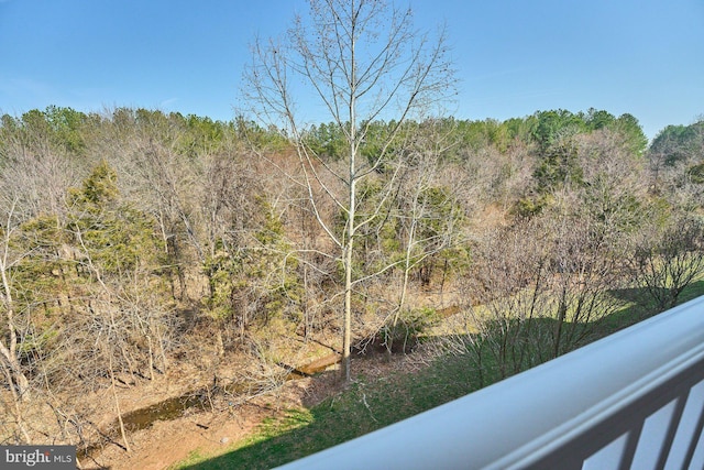 exterior space featuring a view of trees