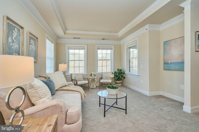 living room with baseboards, crown molding, a tray ceiling, and carpet floors