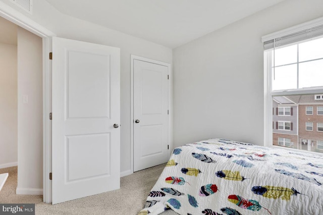 bedroom with light carpet