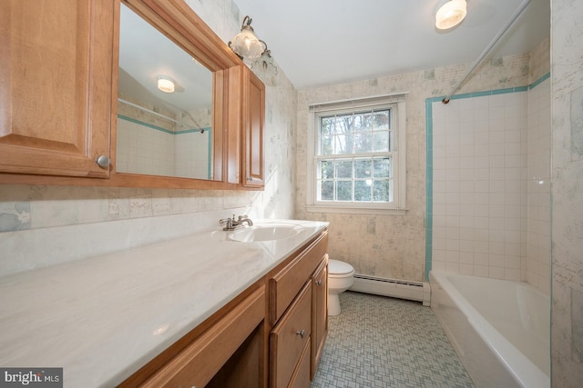 full bathroom with vanity, toilet, tiled shower / bath combo, and a baseboard heating unit