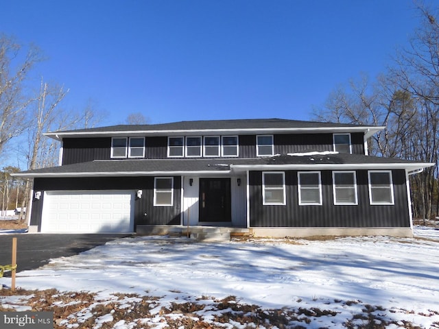 front of property with a garage