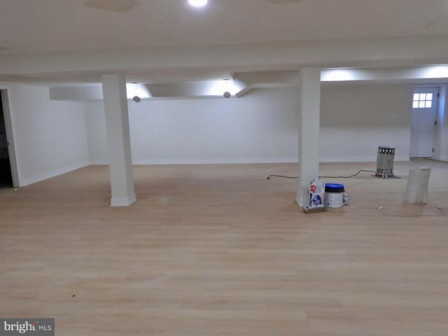 basement featuring light wood-type flooring