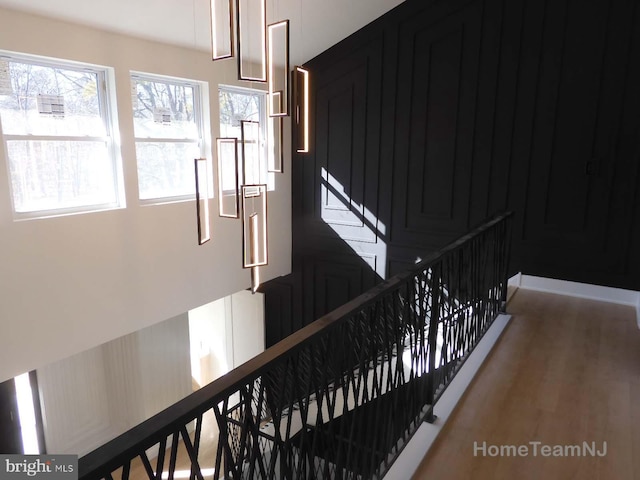 staircase featuring hardwood / wood-style floors