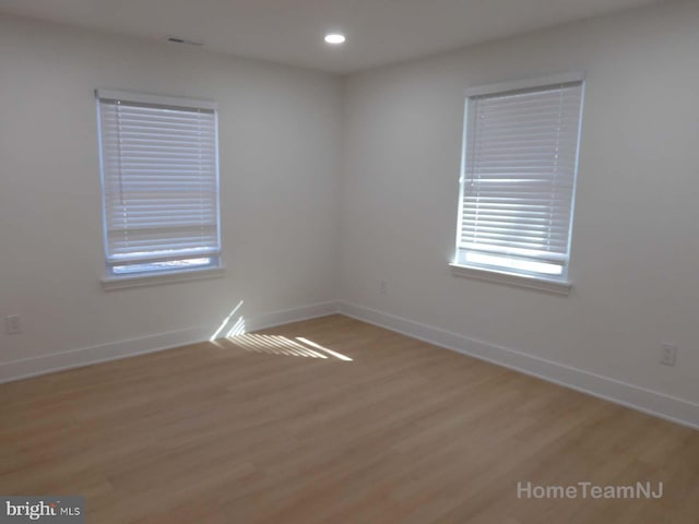 empty room with light wood-type flooring