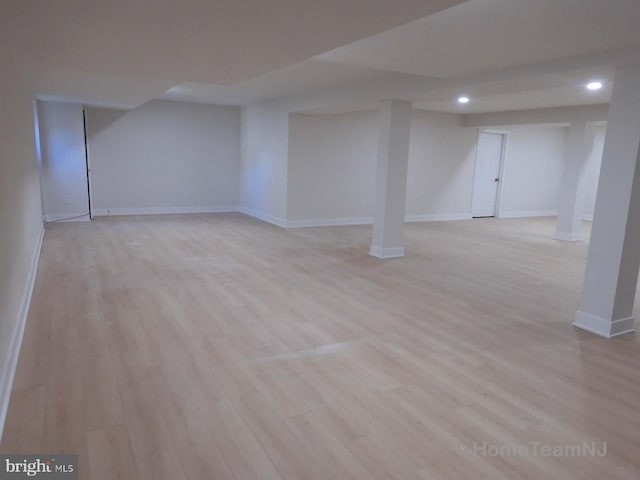 basement featuring light hardwood / wood-style flooring