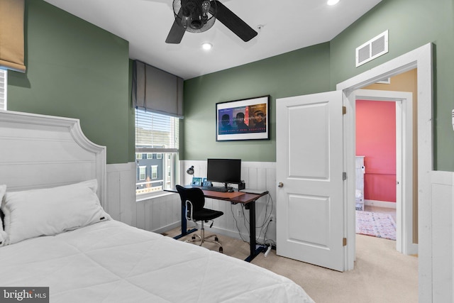 bedroom featuring ceiling fan and light carpet