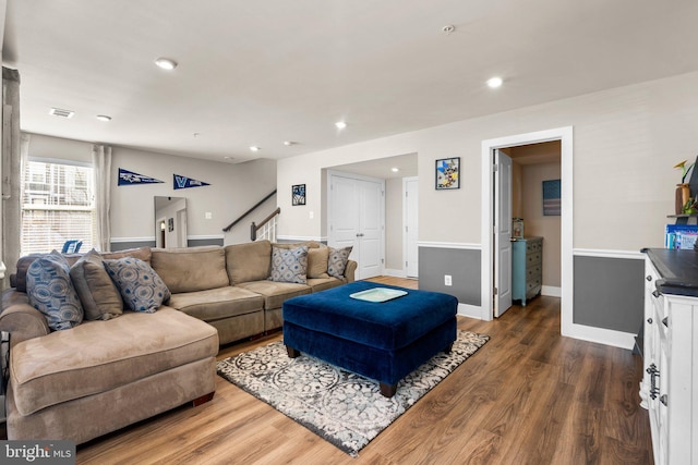 living room featuring dark wood-type flooring