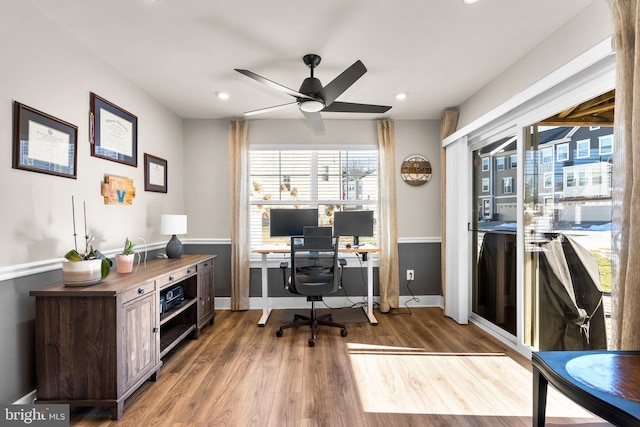 office area with hardwood / wood-style flooring and ceiling fan