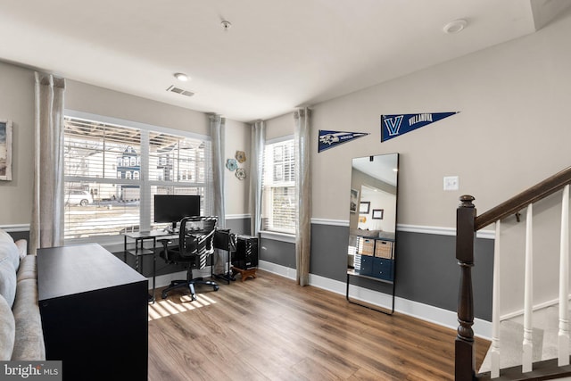 office space featuring lofted ceiling and hardwood / wood-style flooring