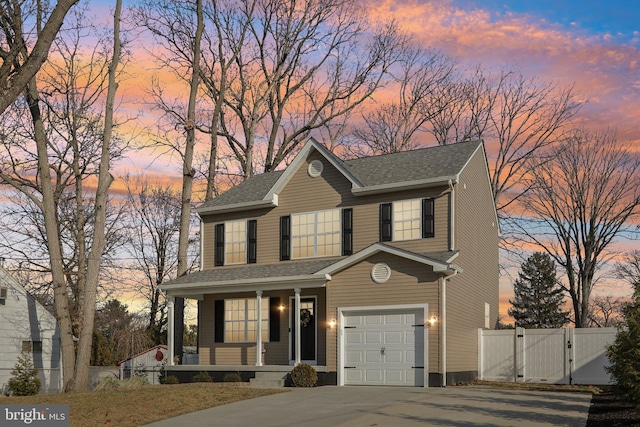 view of front of house with a garage and covered porch