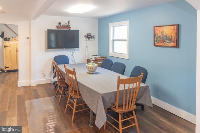 dining area with dark hardwood / wood-style floors