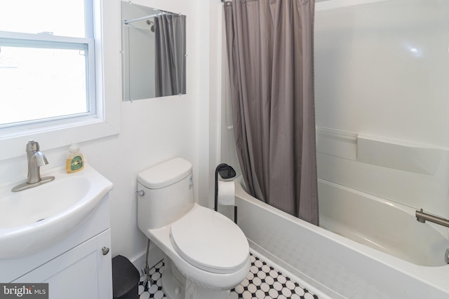 full bathroom featuring vanity, toilet, and shower / bath combo with shower curtain