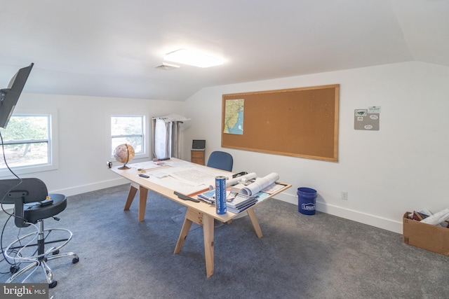 carpeted home office with lofted ceiling