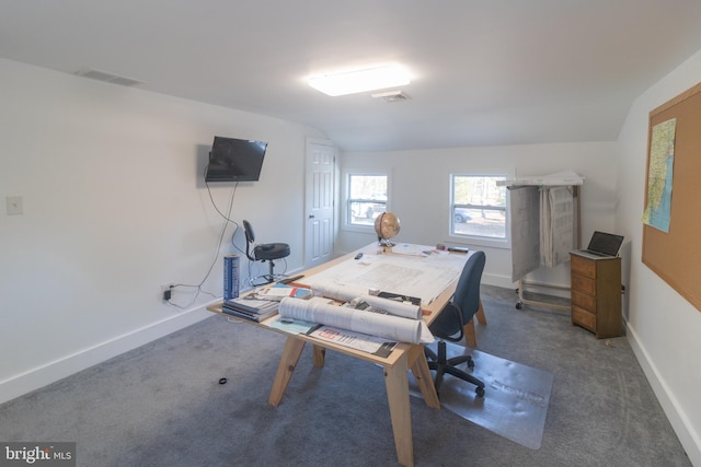 home office featuring dark carpet and vaulted ceiling