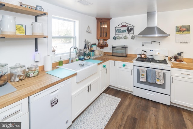 kitchen with extractor fan, white cabinetry, sink, dark hardwood / wood-style flooring, and white appliances