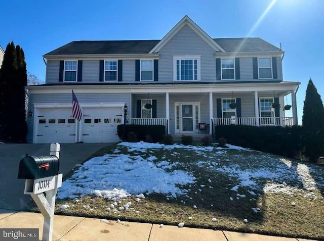 view of front of house featuring a garage and a porch