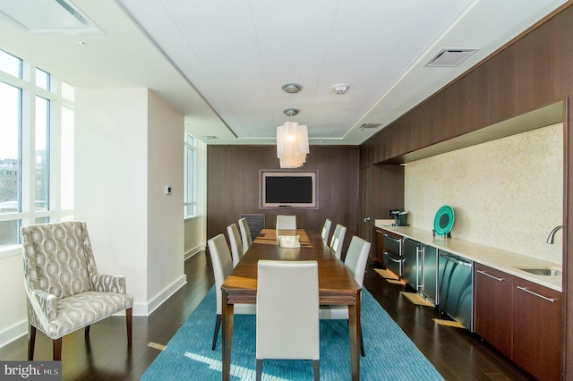 dining area featuring dark hardwood / wood-style flooring and sink