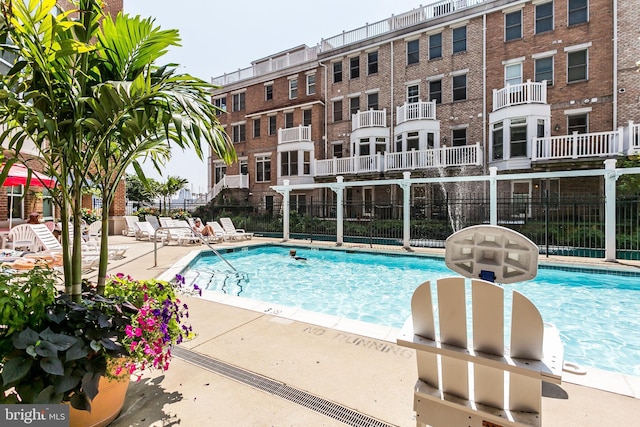 view of swimming pool featuring a patio area