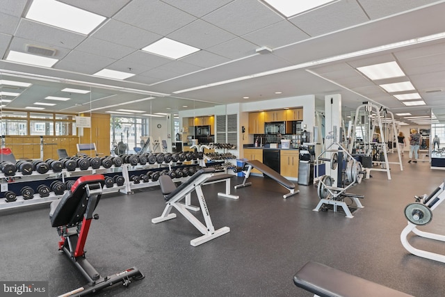 workout area with a paneled ceiling