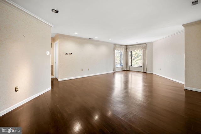 unfurnished room featuring ornamental molding and dark hardwood / wood-style floors