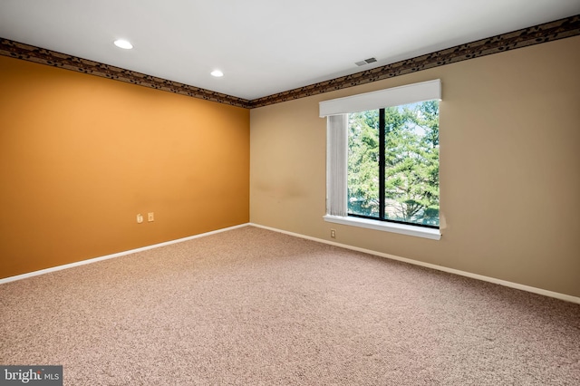 unfurnished room featuring carpet