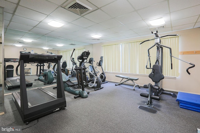 exercise room featuring a paneled ceiling