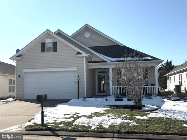 view of front property with cooling unit, a garage, and covered porch