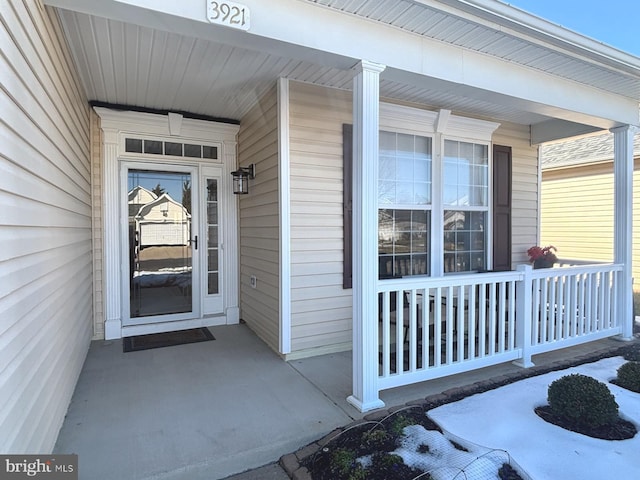 entrance to property featuring covered porch