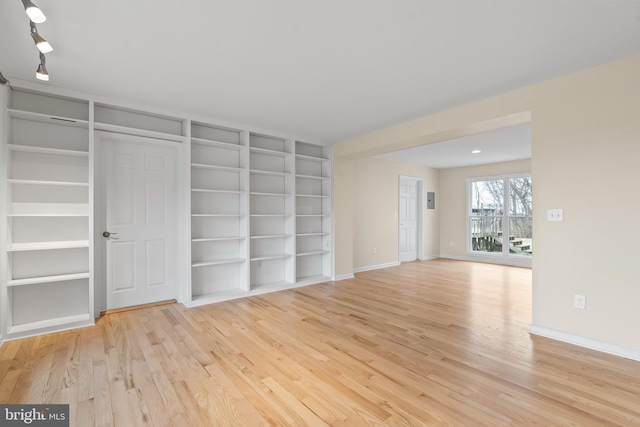 interior space featuring light hardwood / wood-style flooring and built in features