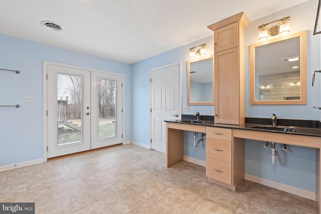 bathroom featuring sink and french doors