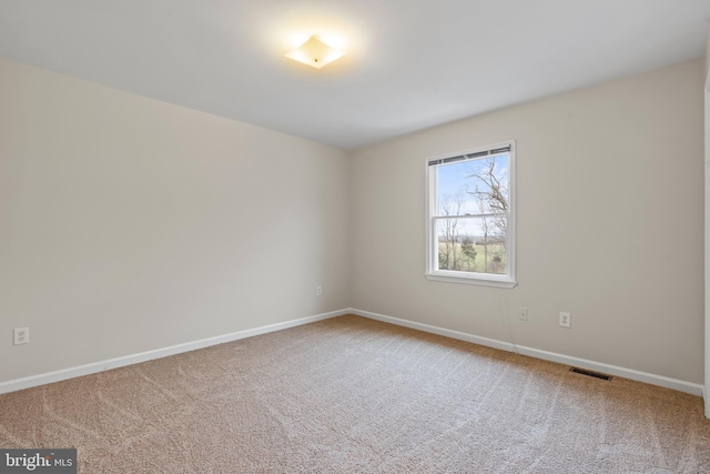 unfurnished room with carpet floors