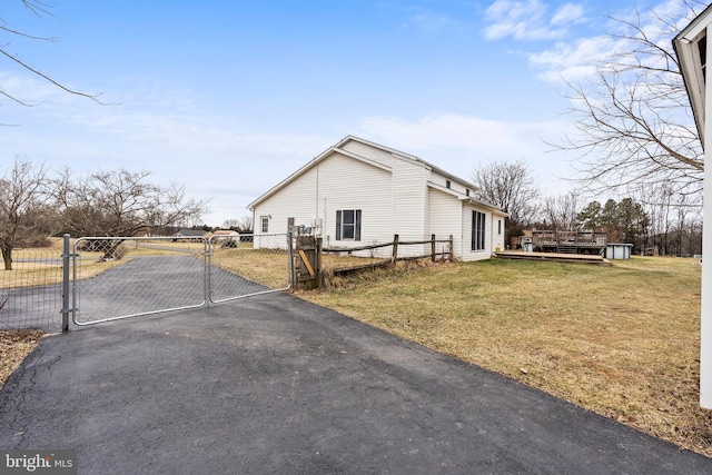 view of side of property with a yard