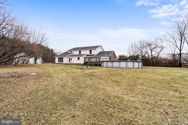 view of yard featuring a pool side deck