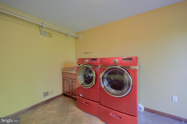 laundry room with washer and dryer, cabinet space, tile patterned floors, visible vents, and baseboards