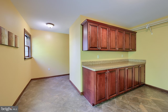 kitchen with light countertops and baseboards