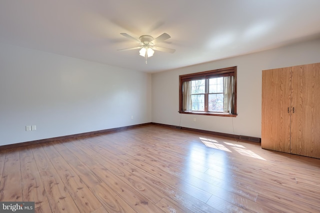 unfurnished bedroom with light wood-style floors, visible vents, and baseboards